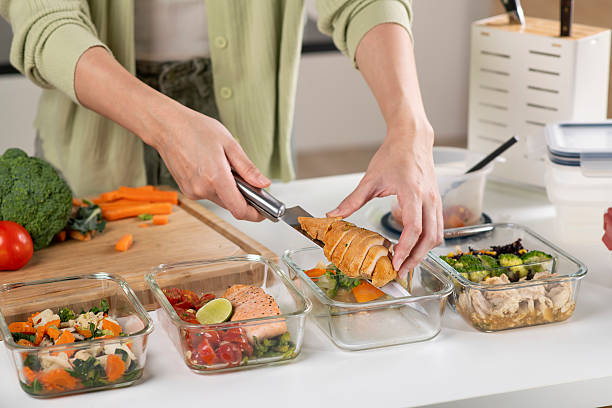 Shopping basket with whole grains, tinned fish, and frozen vegetables